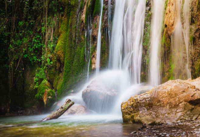 The Mkuzu Waterfalls offer a serene escape into nature, with lush greenery, cascading